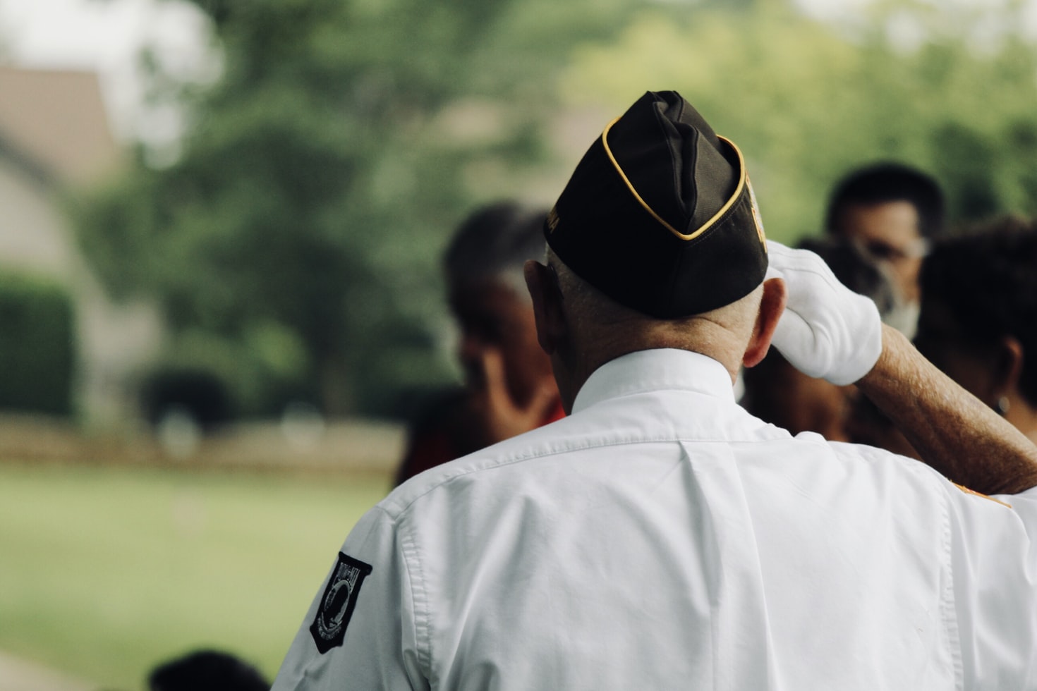 A veteran in uniform saluting
