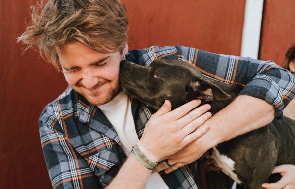 Man hugging a dog
