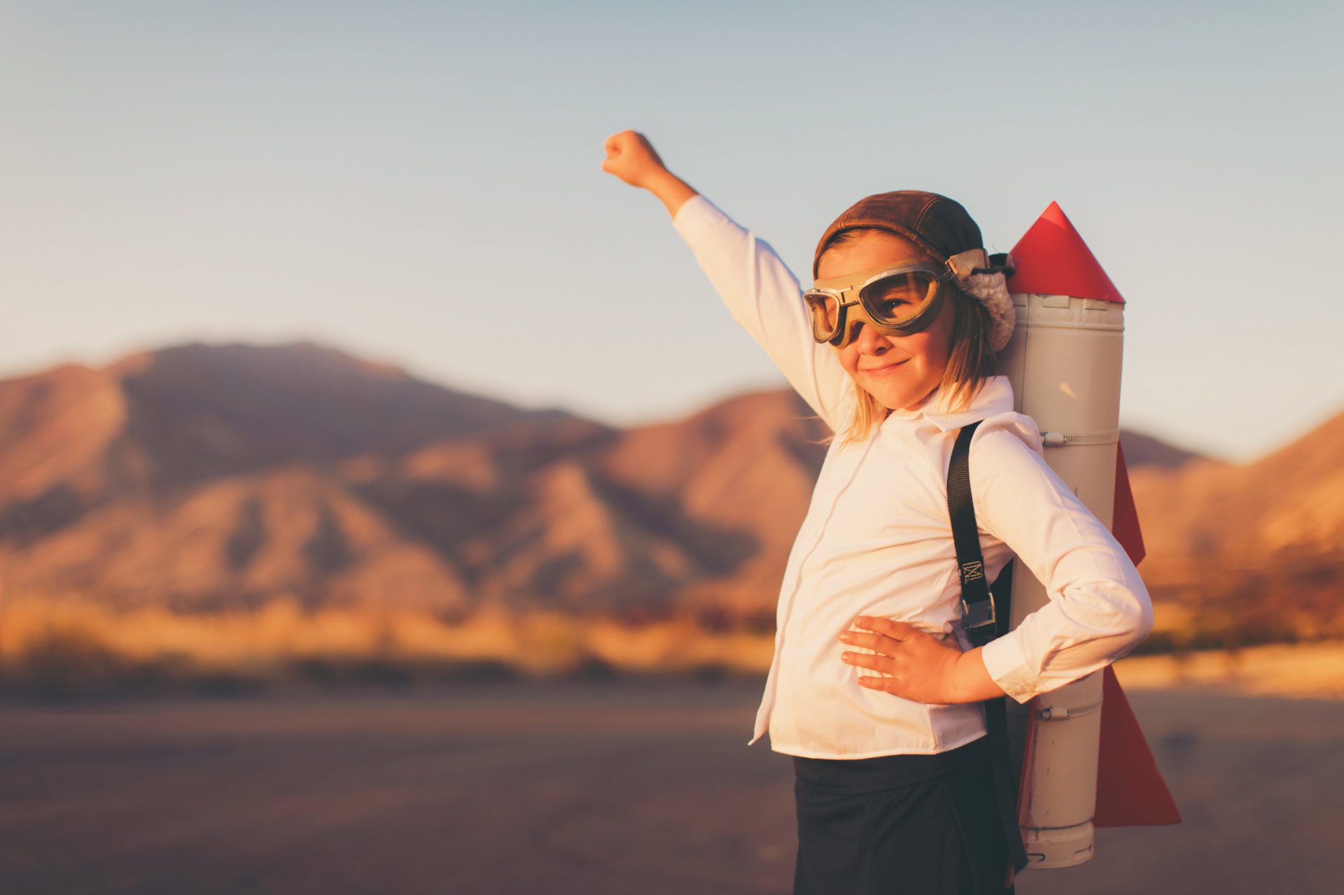 Young Business Girl with Rocket Pack