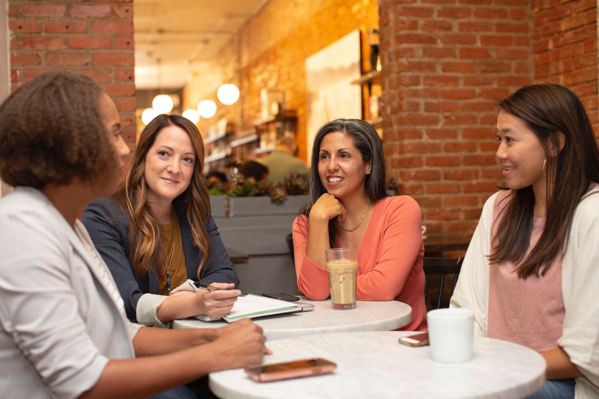 Group of people sitting at a table and talking