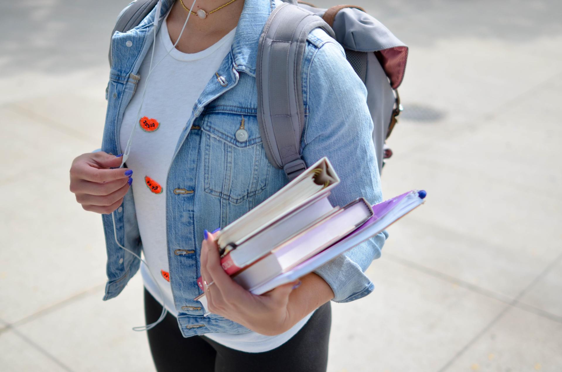 A person holding school books