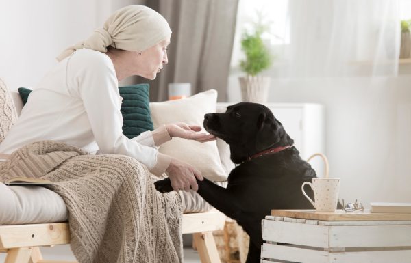 Tumor patient caressing her dog