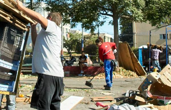 People cleaning up after a natural disaster