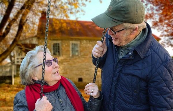 Elderly couple looking at each other