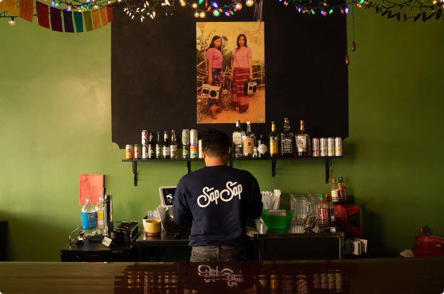 Alex Hanesakda standing at a table