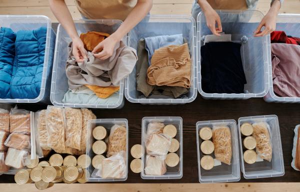 Clothing and food in plastic bins