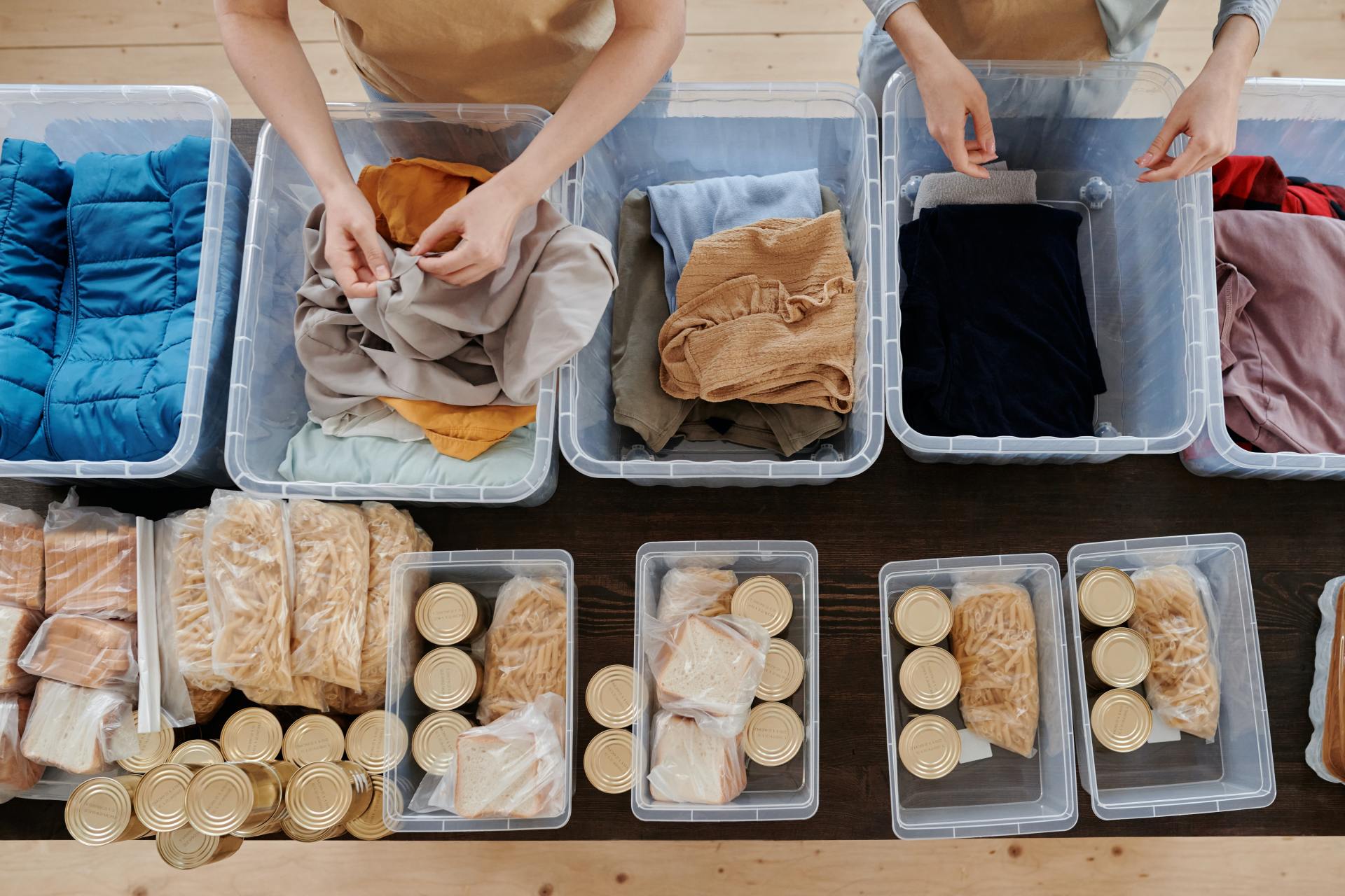 Clothing and food in plastic bins