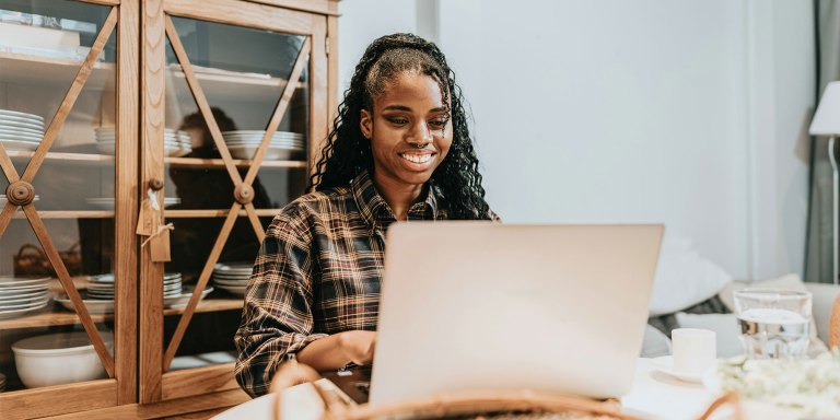 Smiling woman at her computer