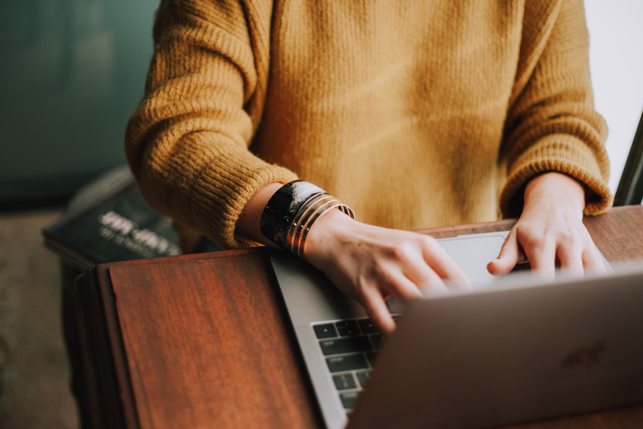 A person typing on a laptop