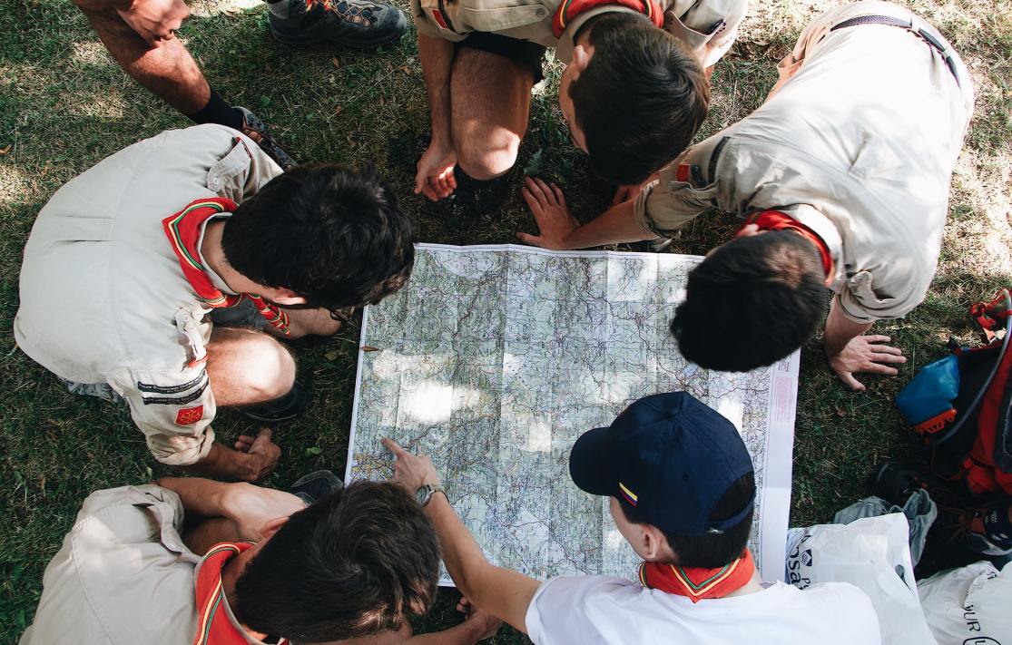 Group of boy scouts looking at a map