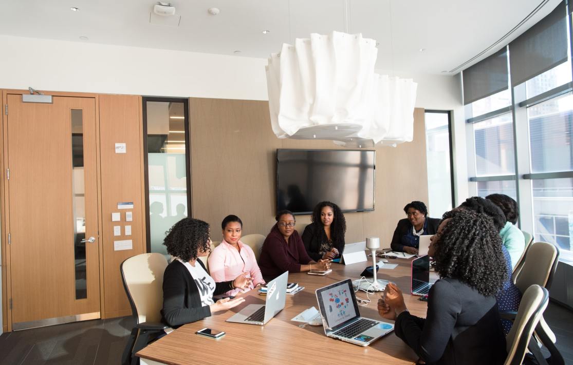 People sitting around a table in a meeting