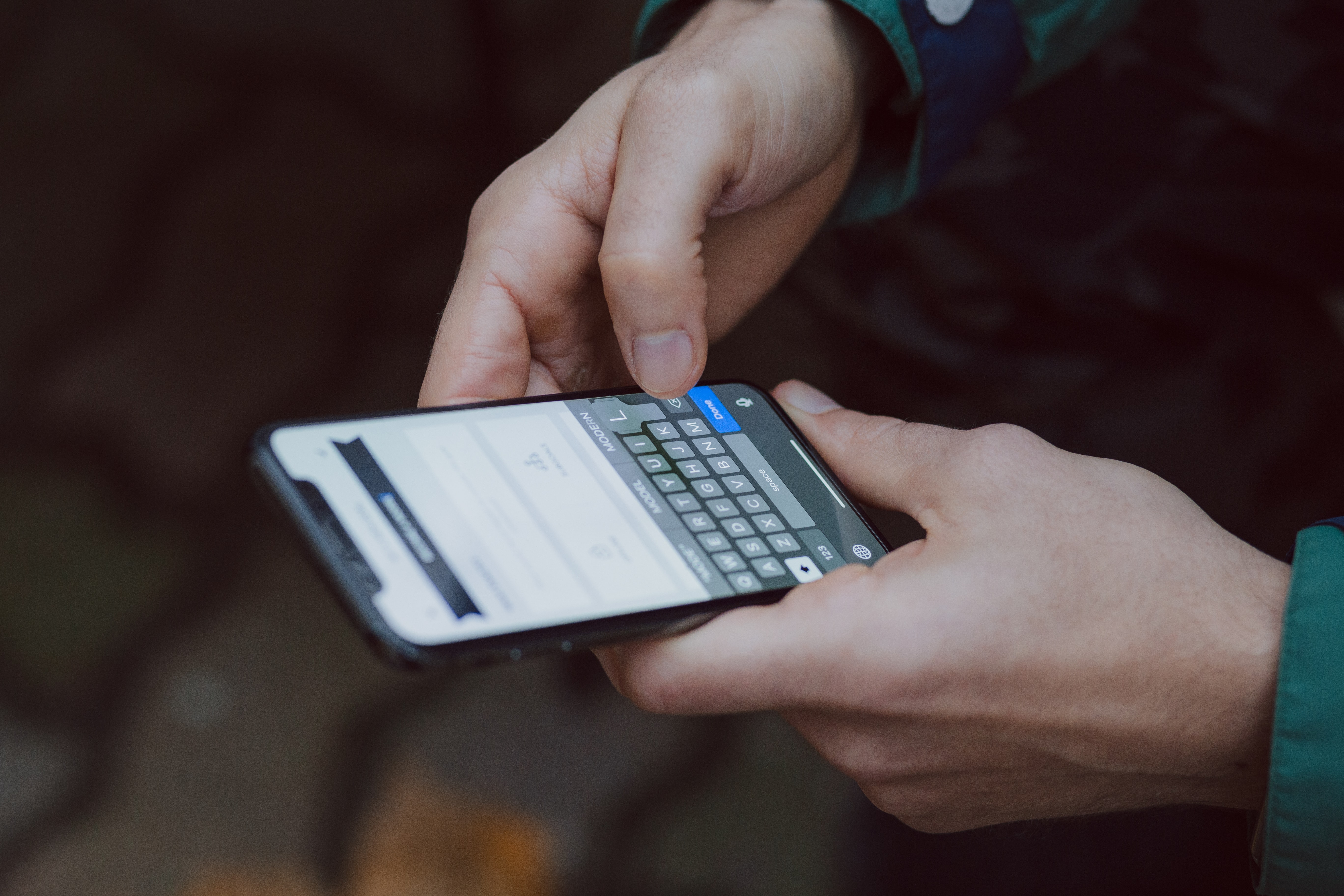 A person typing on their phone