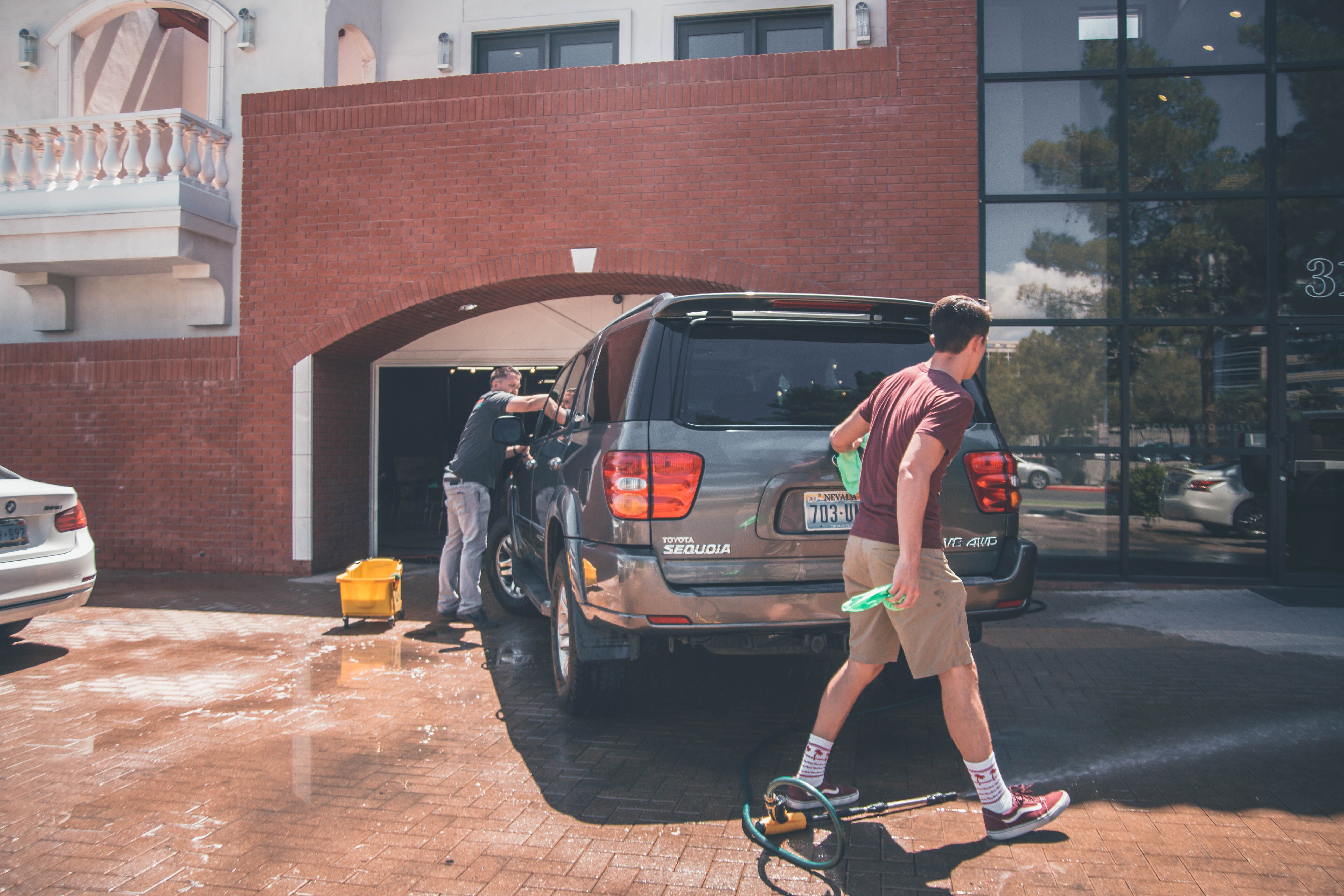 Two people washing a car together