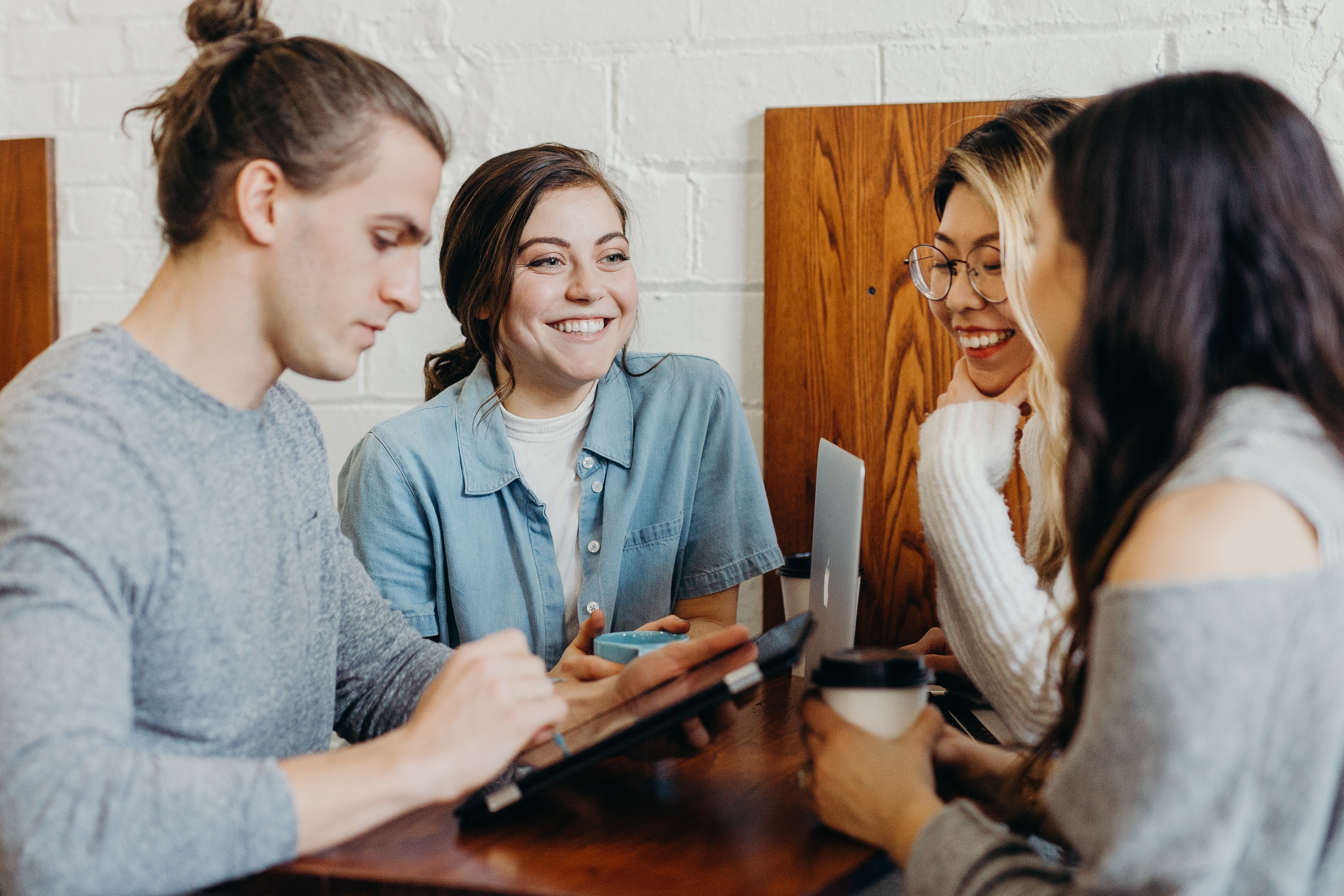 A group of people talking with each other