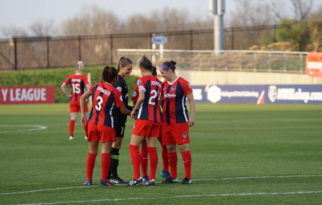 Team huddle on the field