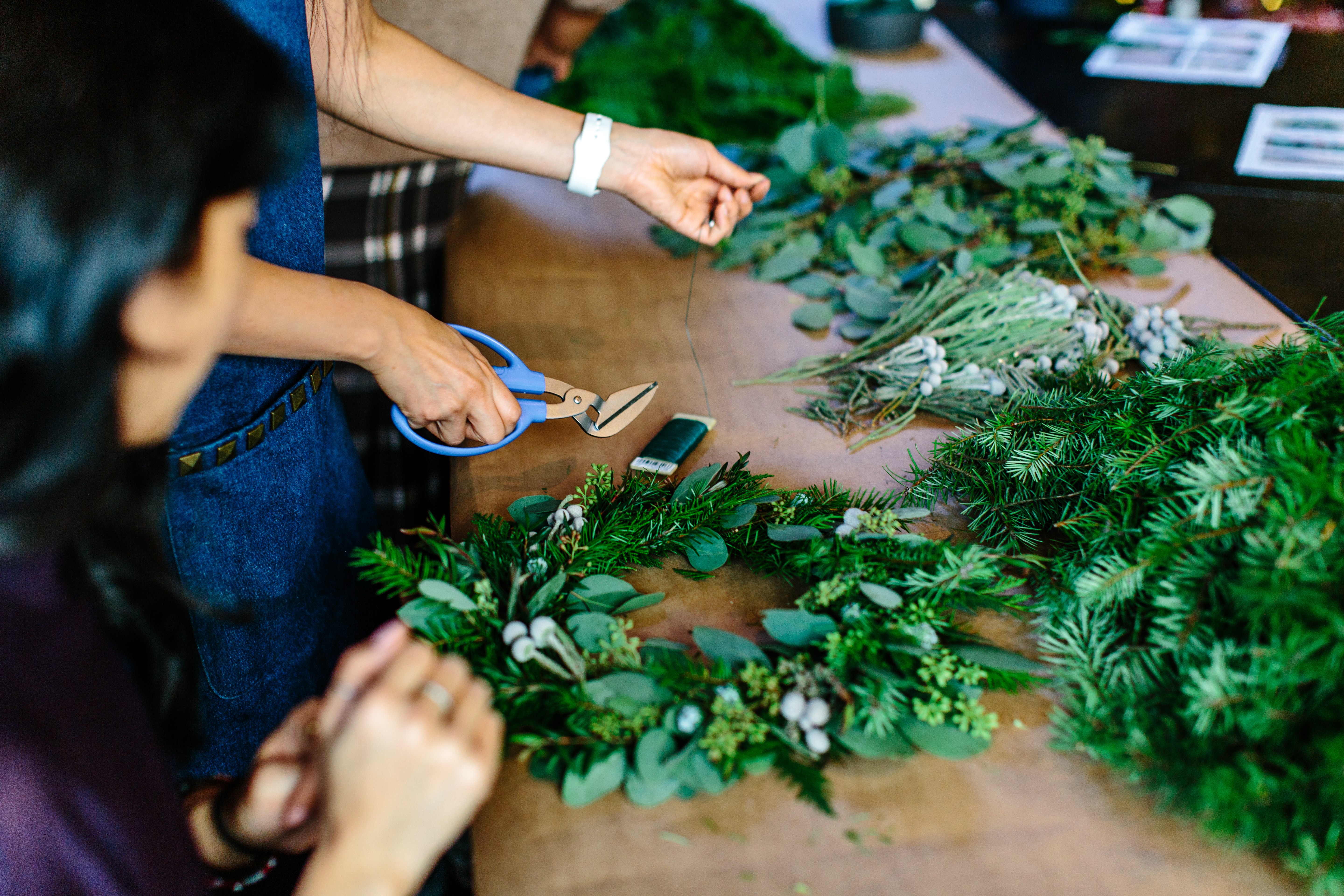 People making handmade wreaths