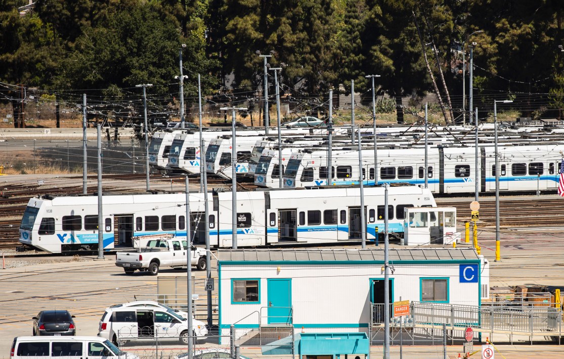 several Valley Transportation Authority (VTA) light rail trains in a yard