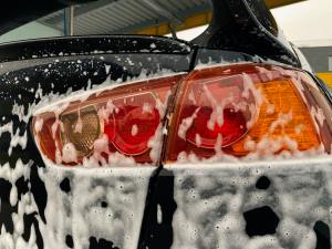 A car being cleaned with soap