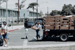 A group of volunteers helping with boxes