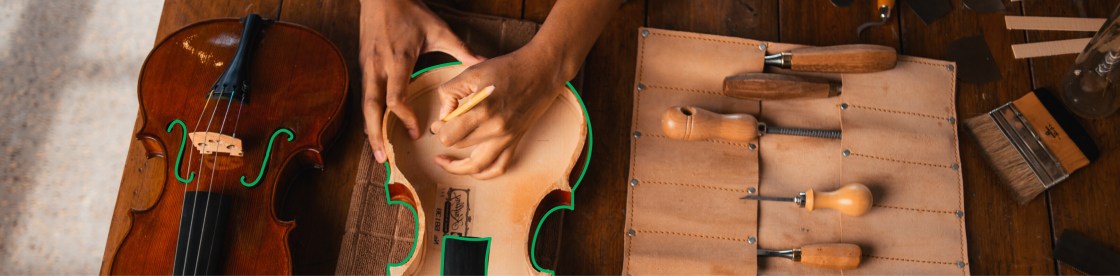 woman crafting a violin