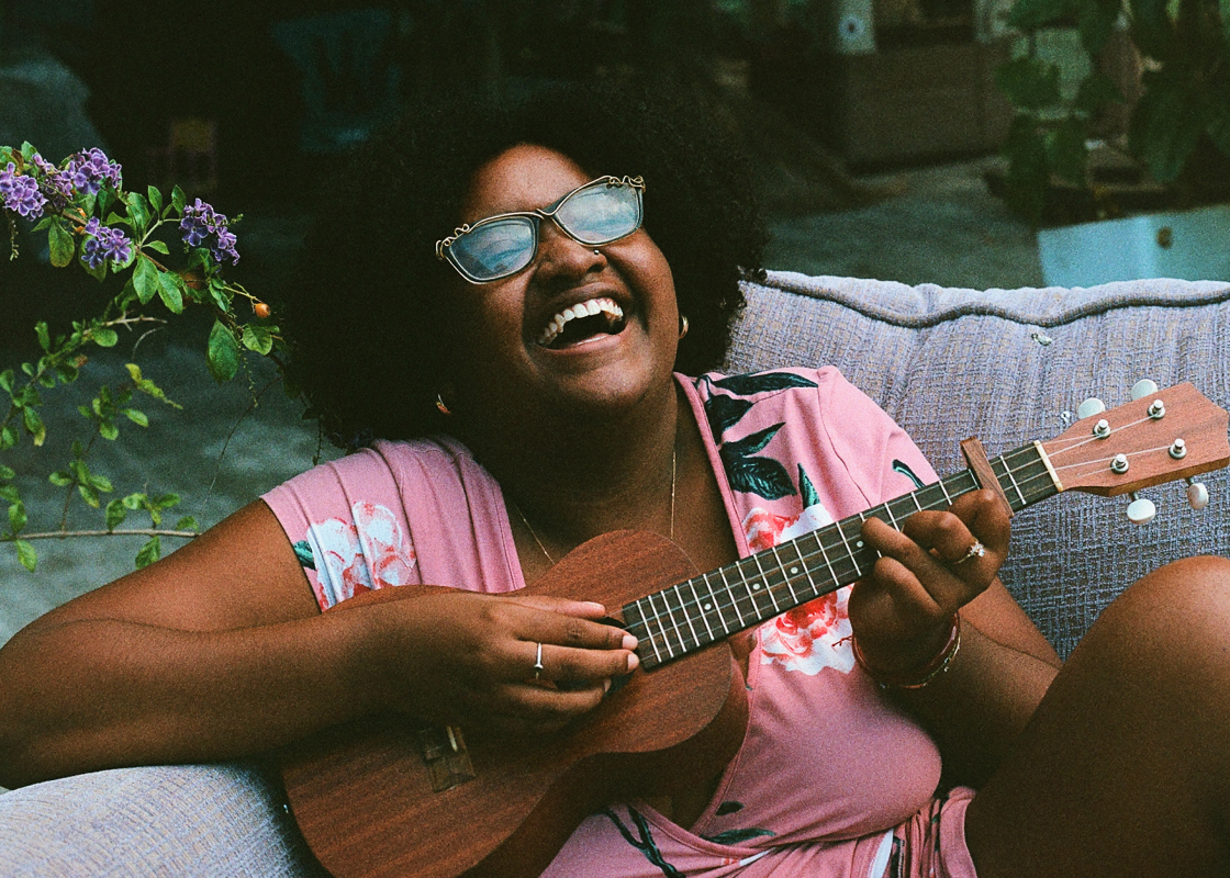 woman playing a guitar