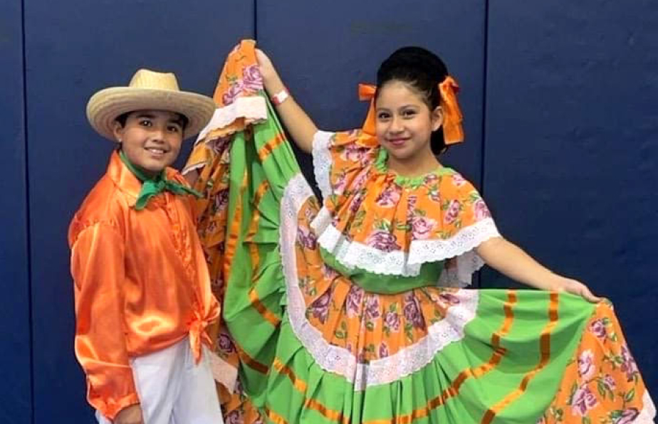 two people standing in the hispanic cultural center