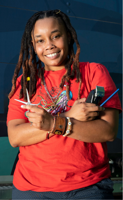 woman holding haircutting tools