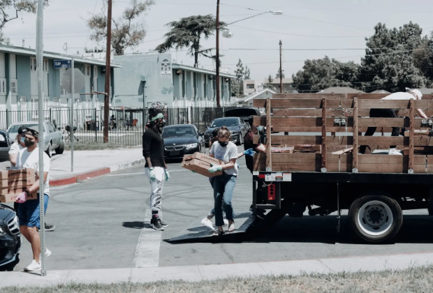 Volunteers unloading food from a truck