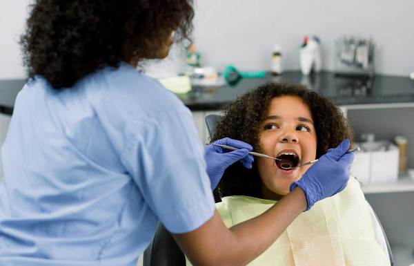 A young girl at the dentist