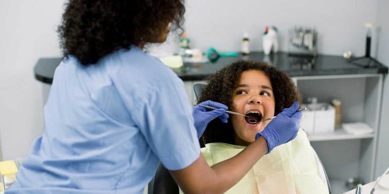 A young girl at the dentist