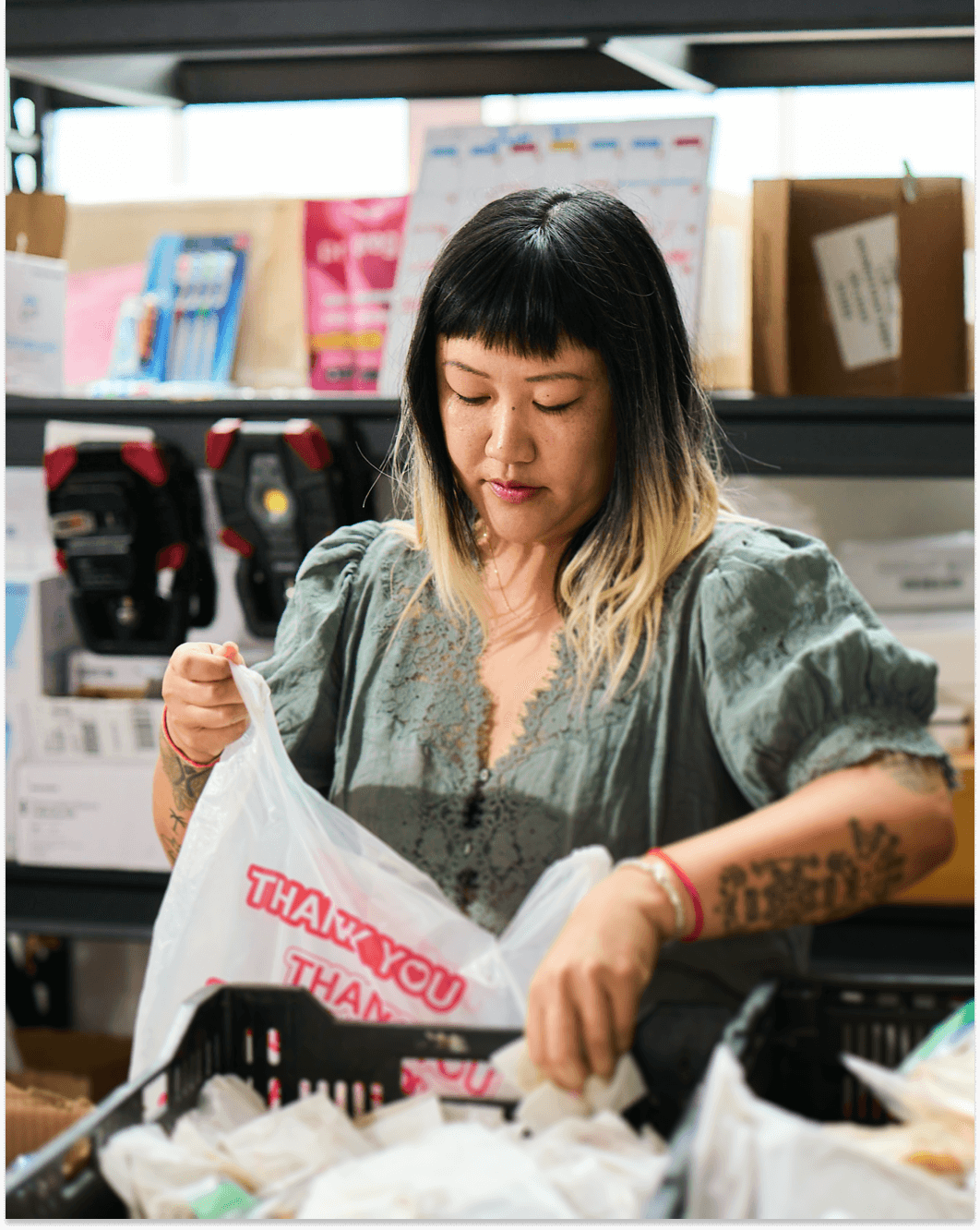 Volunteer packing food at a food bank Volunteer packing food at a food bank