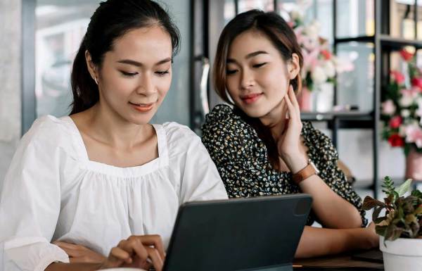 Two women on the computer