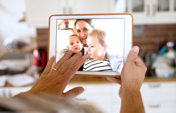 Person holding a tablet looking at a picture