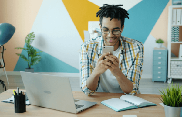 Man on a phone and laptop