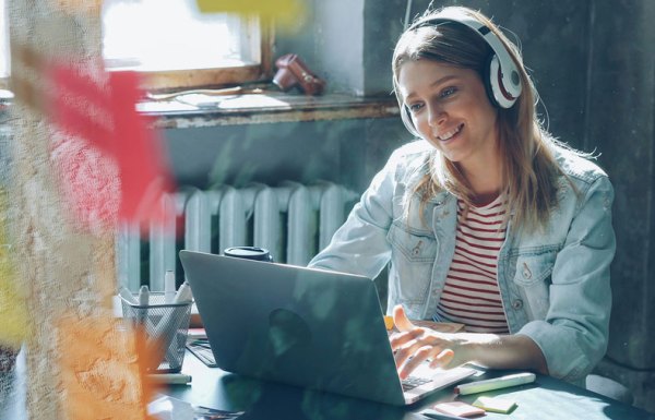 Smiling woman writing a proposal