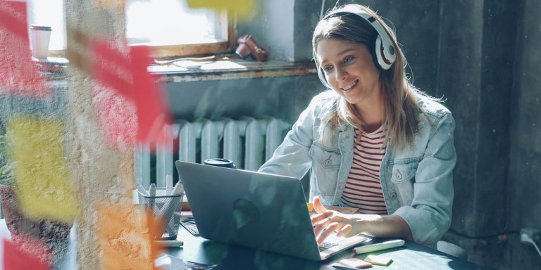 Smiling woman writing a proposal