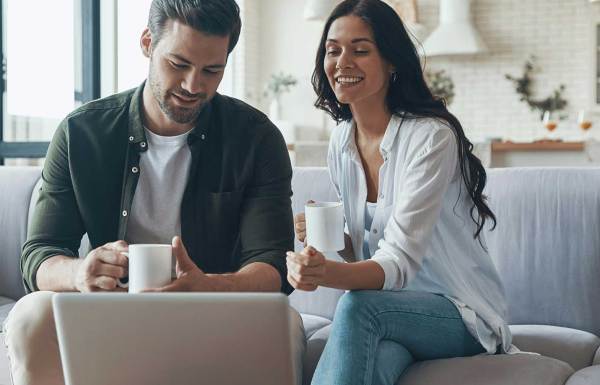 A couple learning about donor advised funds on a laptop