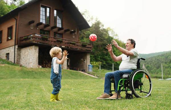 A grandfather playing with his grandchild