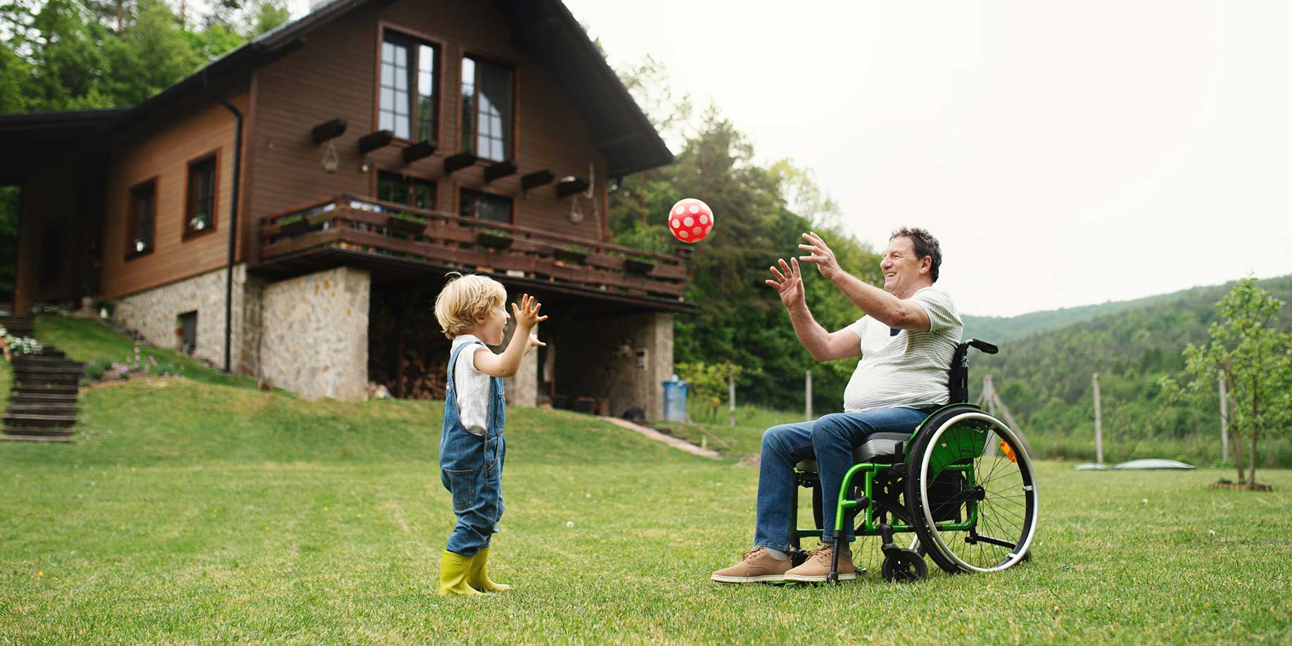 A grandfather playing with his grandchild