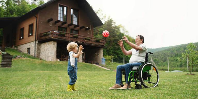 A grandfather playing with his grandchild