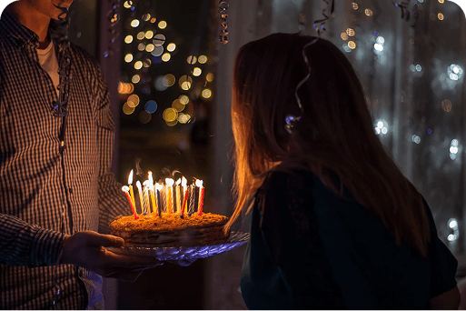 A person blowing out their candles