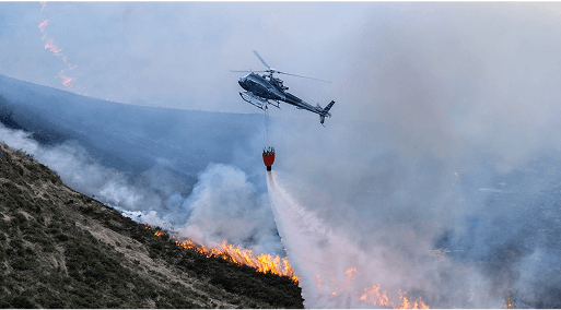 A helicopter battling a wildfire