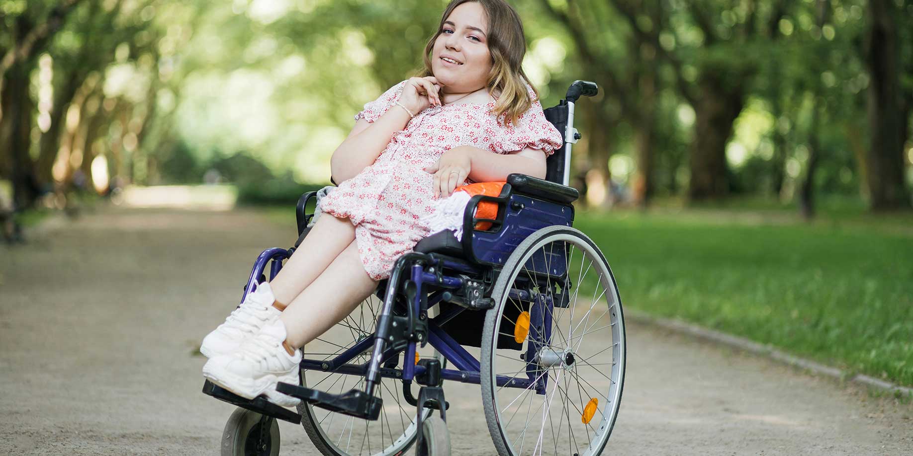 A happy woman in a wheelchair