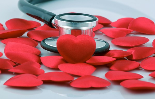 paper red hearts and a stethoscope