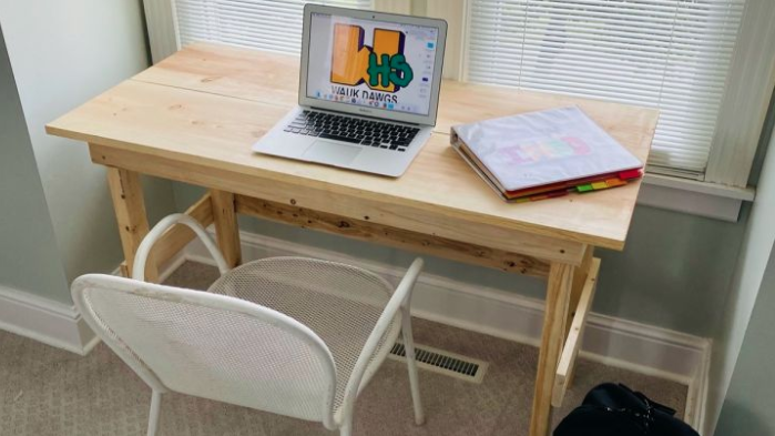 Desk with a laptop on notebook