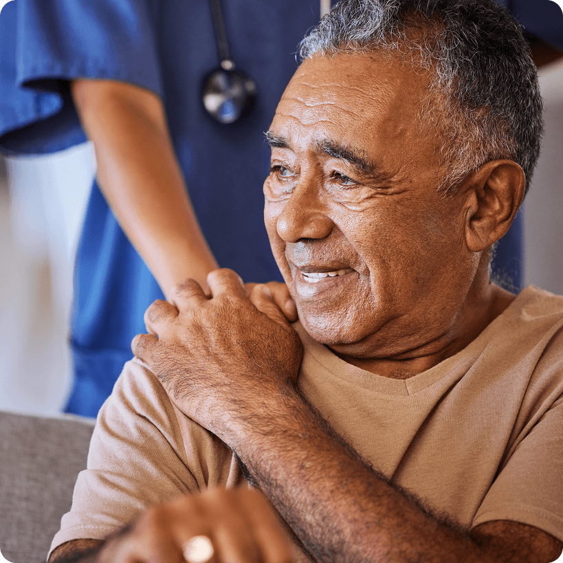 A patient receiving support from a medical professional