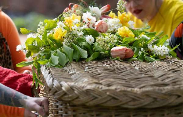 Family and friends carrying a coffin