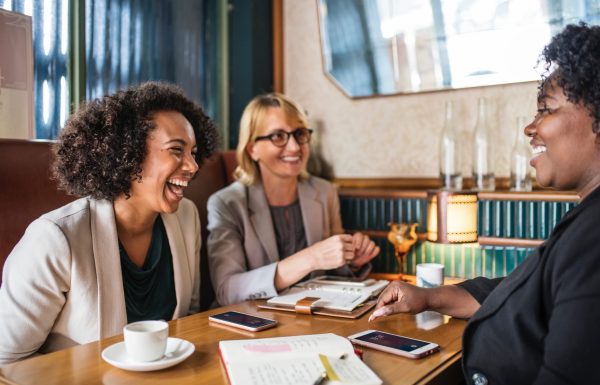 Group of professional women talking at a table