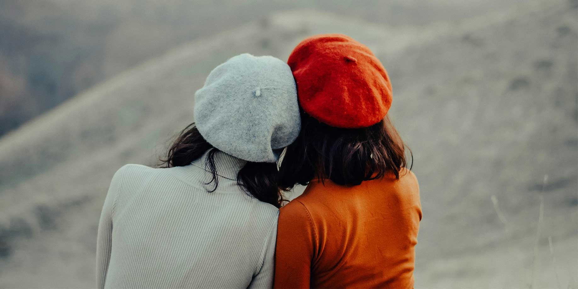 Sisters hugging one another