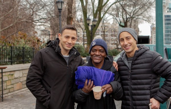 Three young people standing outside